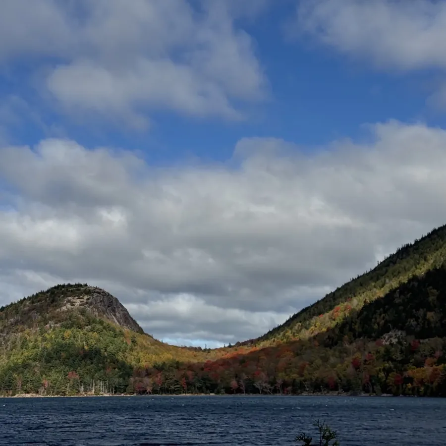 autumn hills across a mountain lake