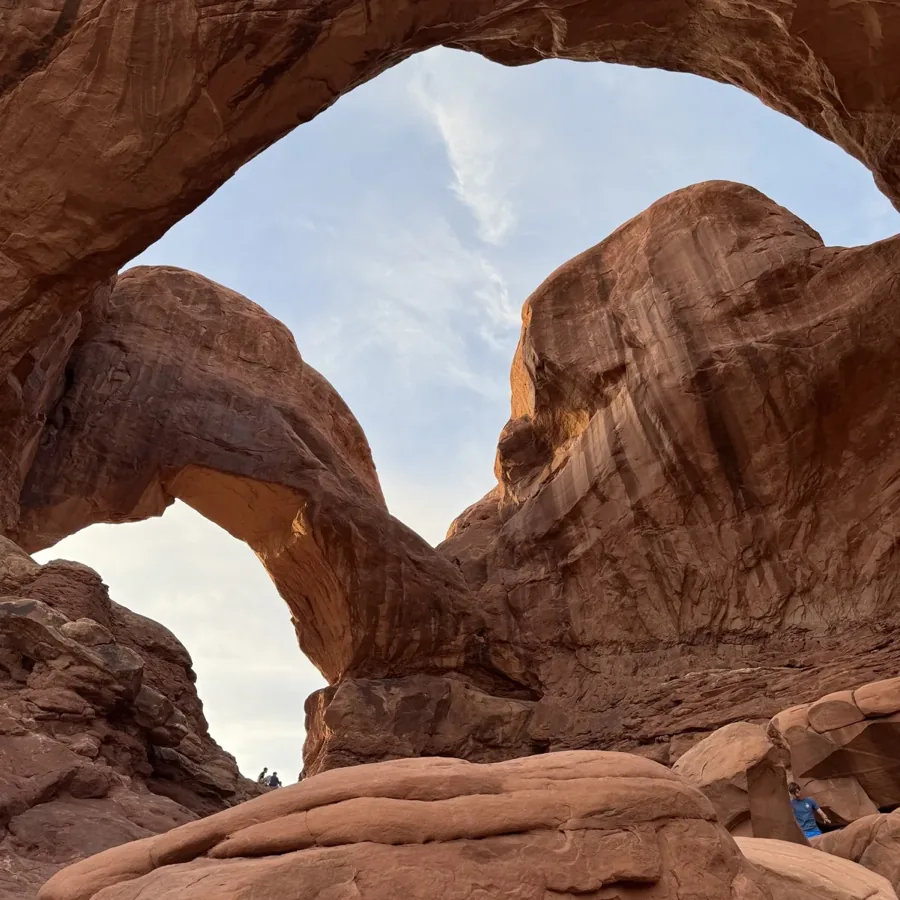 looking up through red stone arches